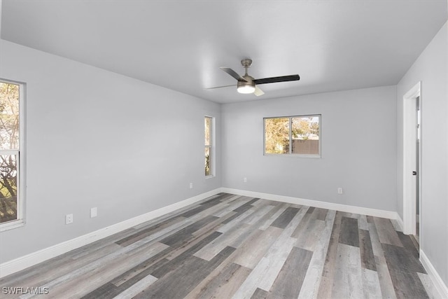 spare room featuring ceiling fan and hardwood / wood-style floors