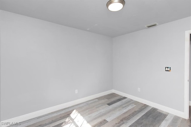 empty room with light hardwood / wood-style floors