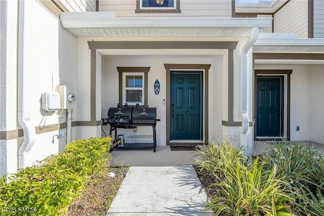15050 Caspian Tern Ct Unit 102, North Fort Myers, FL 33917 - property entrance featuring covered porch and stucco siding