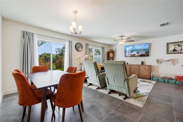 15050 Caspian Tern Ct Unit 102, North Fort Myers, FL 33917 - dining room featuring visible vents and ceiling fan with notable chandelier