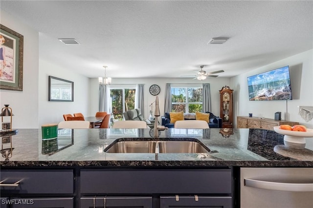 15050 Caspian Tern Ct Unit 102, North Fort Myers, FL 33917 - kitchen featuring stainless steel dishwasher, visible vents, open floor plan, and a sink