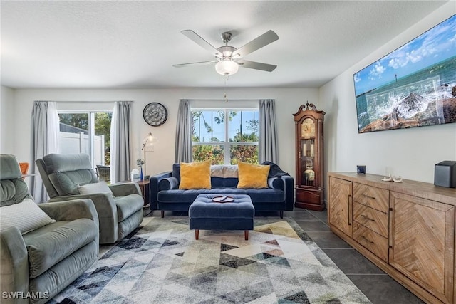 15050 Caspian Tern Ct Unit 102, North Fort Myers, FL 33917 - living room with tile patterned floors, a ceiling fan, and a healthy amount of sunlight