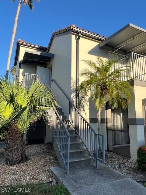 view of side of property with a balcony