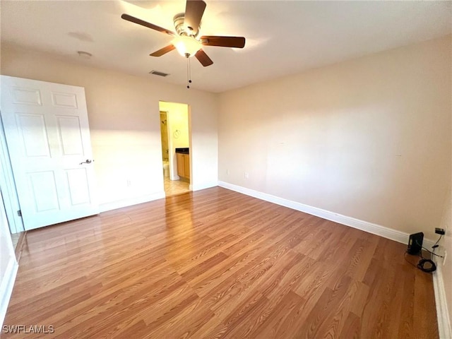 unfurnished room featuring ceiling fan and light hardwood / wood-style flooring