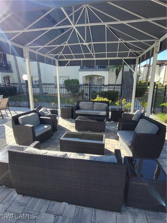 view of patio featuring outdoor lounge area and a gazebo