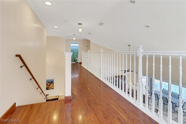 hallway featuring lofted ceiling and dark hardwood / wood-style floors