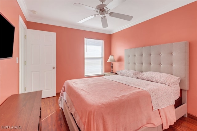 bedroom featuring ornamental molding, wood-type flooring, and ceiling fan