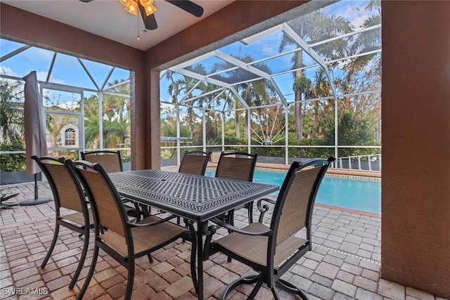 view of patio / terrace featuring a lanai and ceiling fan