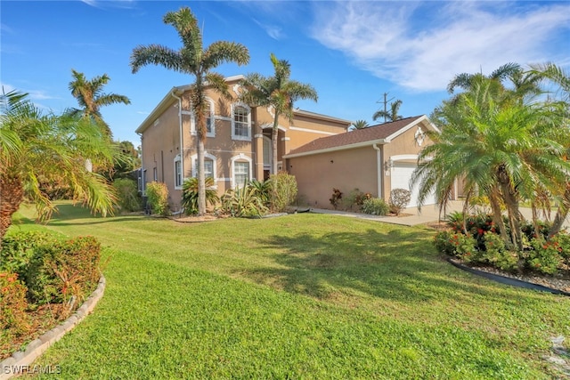 mediterranean / spanish-style house featuring a front lawn