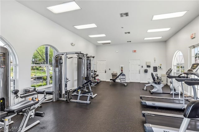 workout area featuring a high ceiling