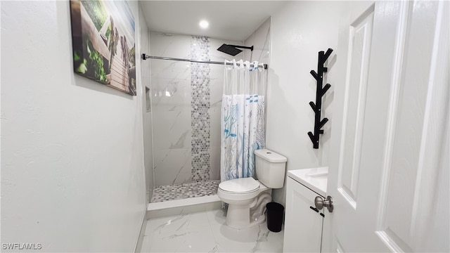 bathroom featuring vanity, toilet, and a shower with shower curtain