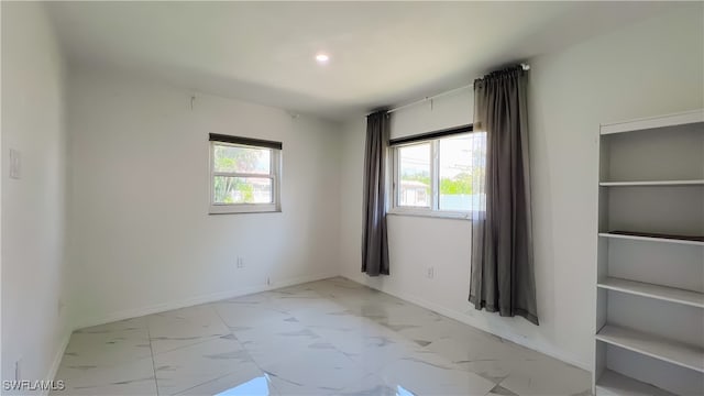 spare room with built in shelves