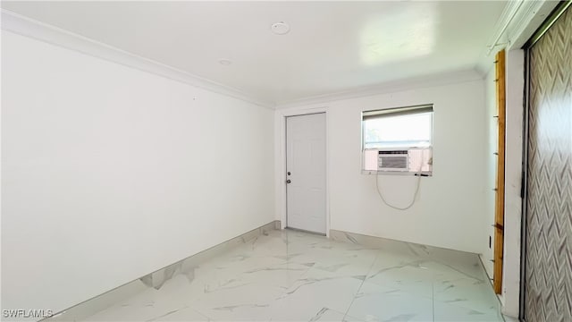 spare room with ornamental molding and cooling unit