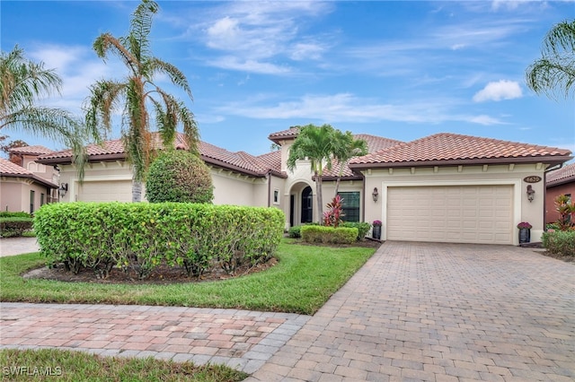 mediterranean / spanish-style house featuring a garage