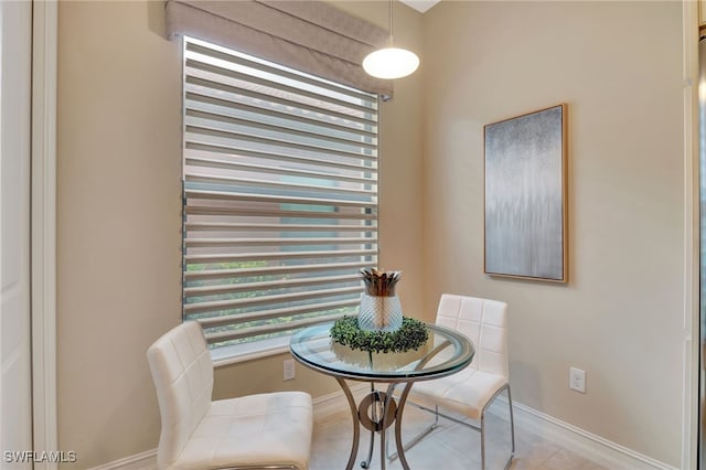 dining area featuring light tile patterned floors