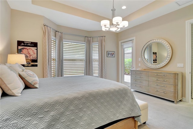 bedroom with a notable chandelier, light carpet, and access to exterior