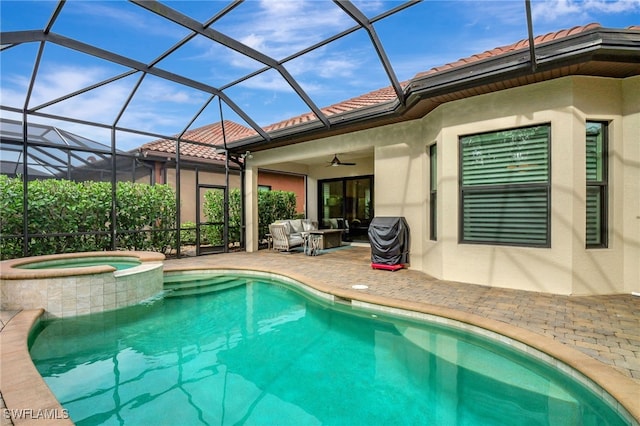 view of pool featuring ceiling fan, an outdoor living space, a lanai, a patio area, and an in ground hot tub