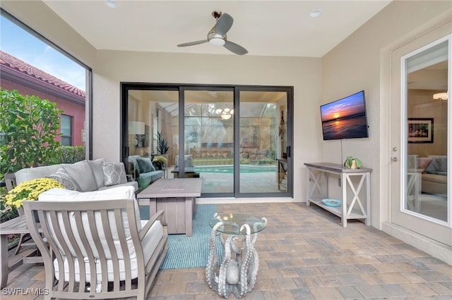 sunroom / solarium with ceiling fan