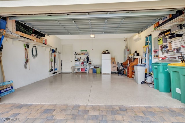 garage with white fridge and a workshop area