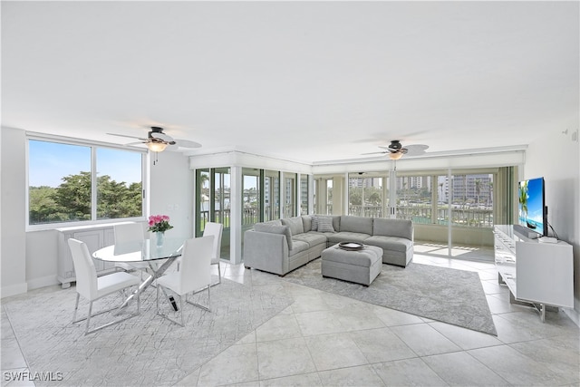 tiled living room with ceiling fan