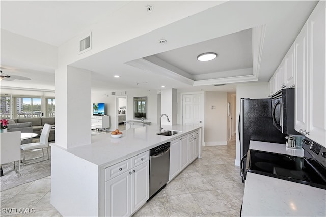 kitchen featuring white cabinets, light stone countertops, sink, and appliances with stainless steel finishes