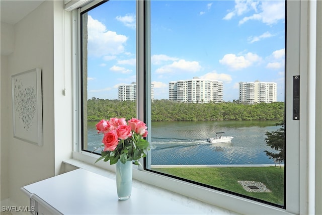 doorway to outside featuring a water view