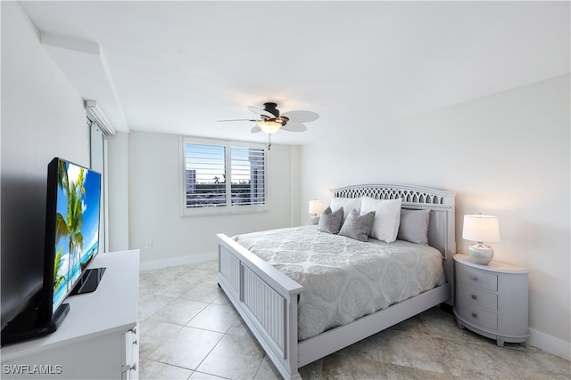 tiled bedroom with ceiling fan