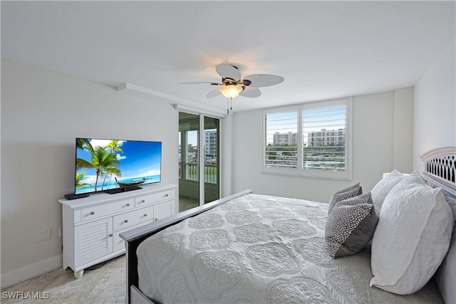 bedroom featuring ceiling fan and access to exterior