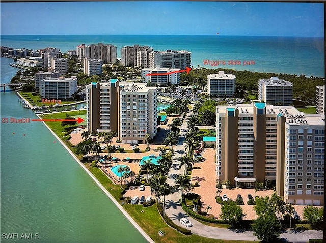 birds eye view of property featuring a water view