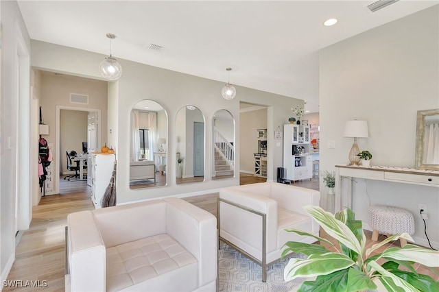 living room with light hardwood / wood-style flooring