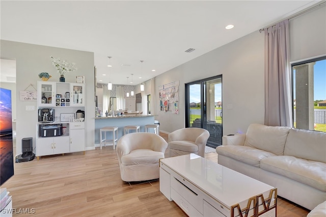 living room with light hardwood / wood-style floors