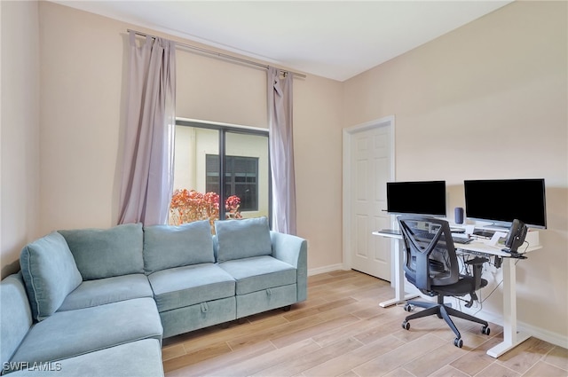 office space with light hardwood / wood-style floors