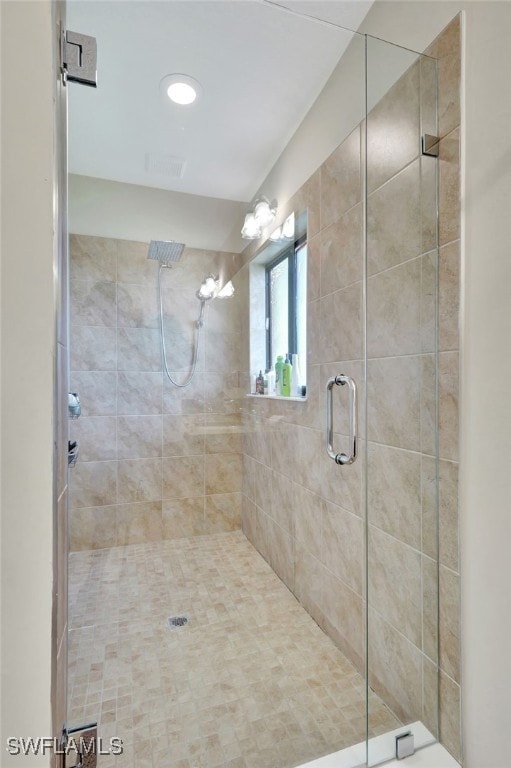 bathroom featuring an enclosed shower