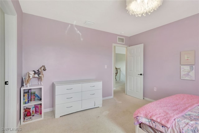 bedroom featuring light carpet