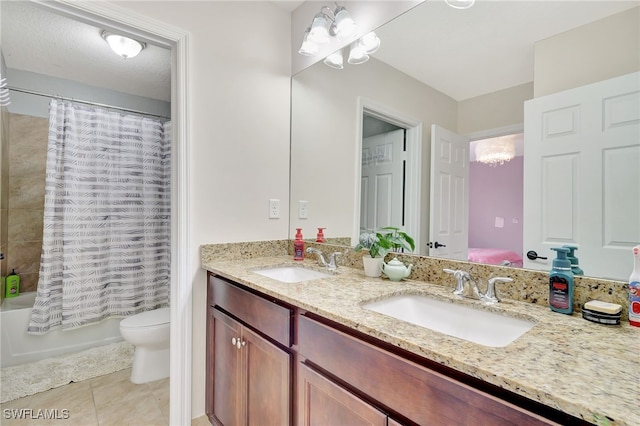 full bathroom featuring toilet, tile patterned floors, vanity, shower / tub combo with curtain, and a chandelier