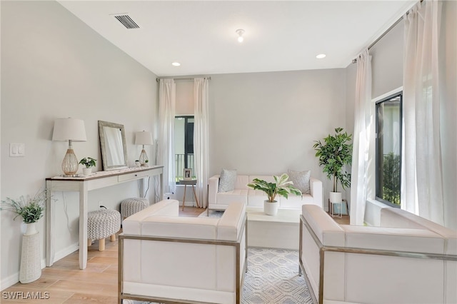 living room with light hardwood / wood-style flooring