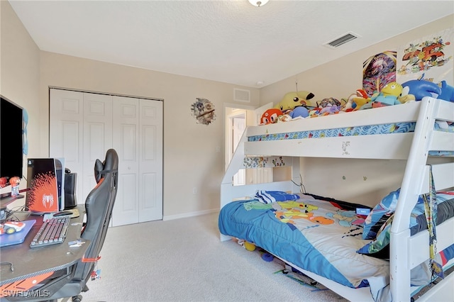 bedroom featuring carpet floors and a closet