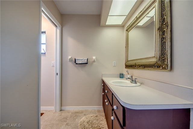 bathroom with vanity and tile patterned flooring