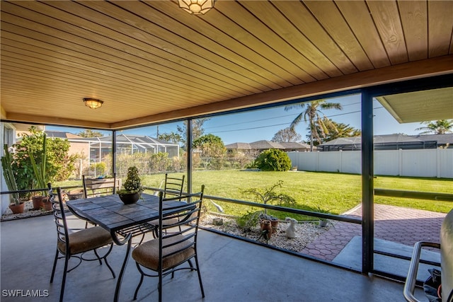 sunroom / solarium featuring wooden ceiling