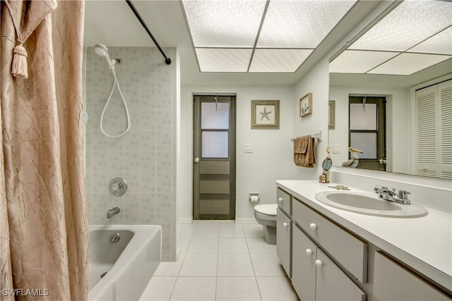 full bathroom featuring vanity, shower / tub combo, toilet, and tile patterned flooring