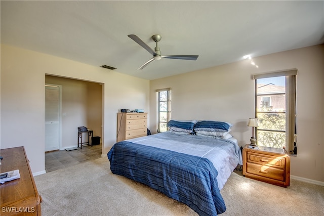 carpeted bedroom featuring ceiling fan