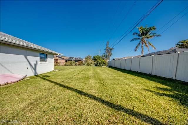 view of yard featuring a lanai