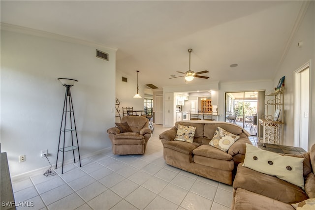 living room with ornamental molding, light tile patterned floors, and ceiling fan