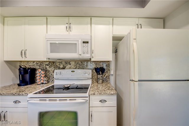 kitchen with decorative backsplash, white cabinetry, and white appliances