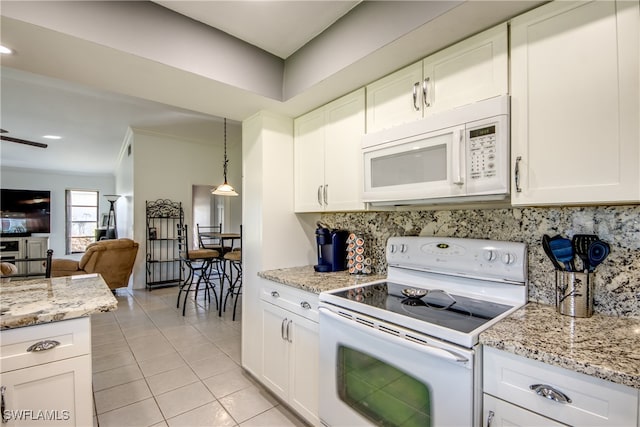 kitchen with decorative backsplash, light tile patterned flooring, decorative light fixtures, white cabinets, and white appliances