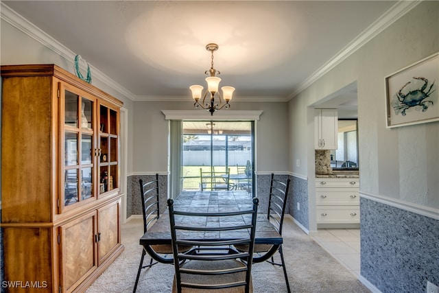 tiled dining space featuring an inviting chandelier and crown molding