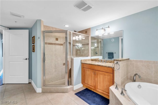 bathroom featuring tile patterned floors, vanity, and independent shower and bath