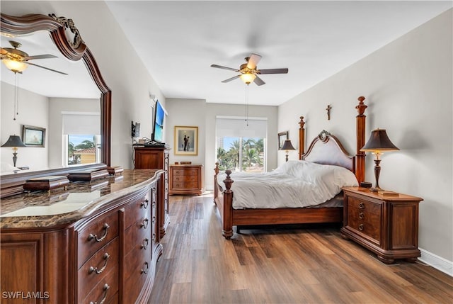 bedroom featuring ceiling fan and dark hardwood / wood-style floors