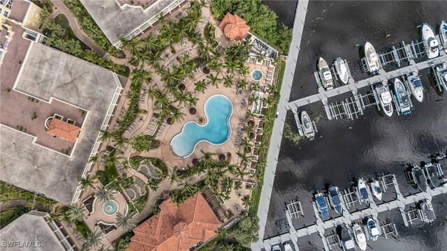 birds eye view of property with a water view