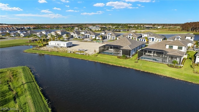 birds eye view of property with a residential view and a water view